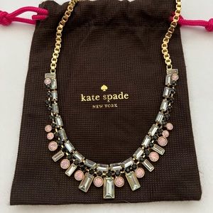 Kate Spade gold necklace with clear, black, and pink stones